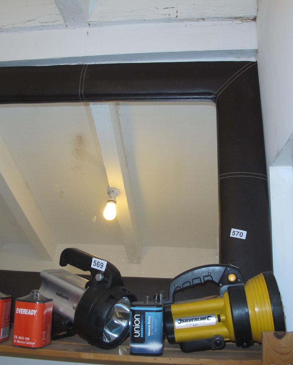 Lot 570: Faux leather framed mirror