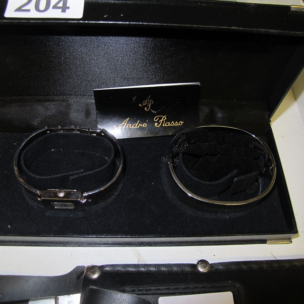 Lot 204: André Pisso watch and bracelet set. Perfect gift...