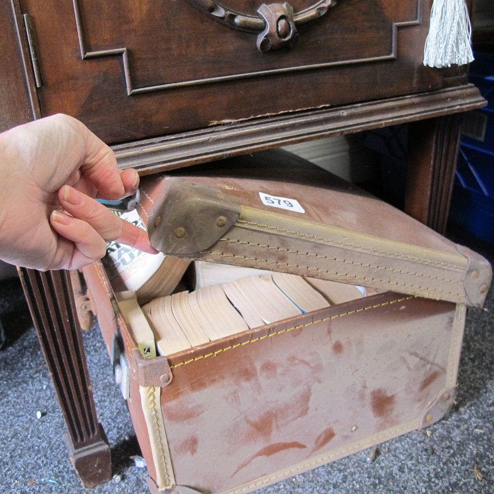 Lot 579: Vintage suitcase of books