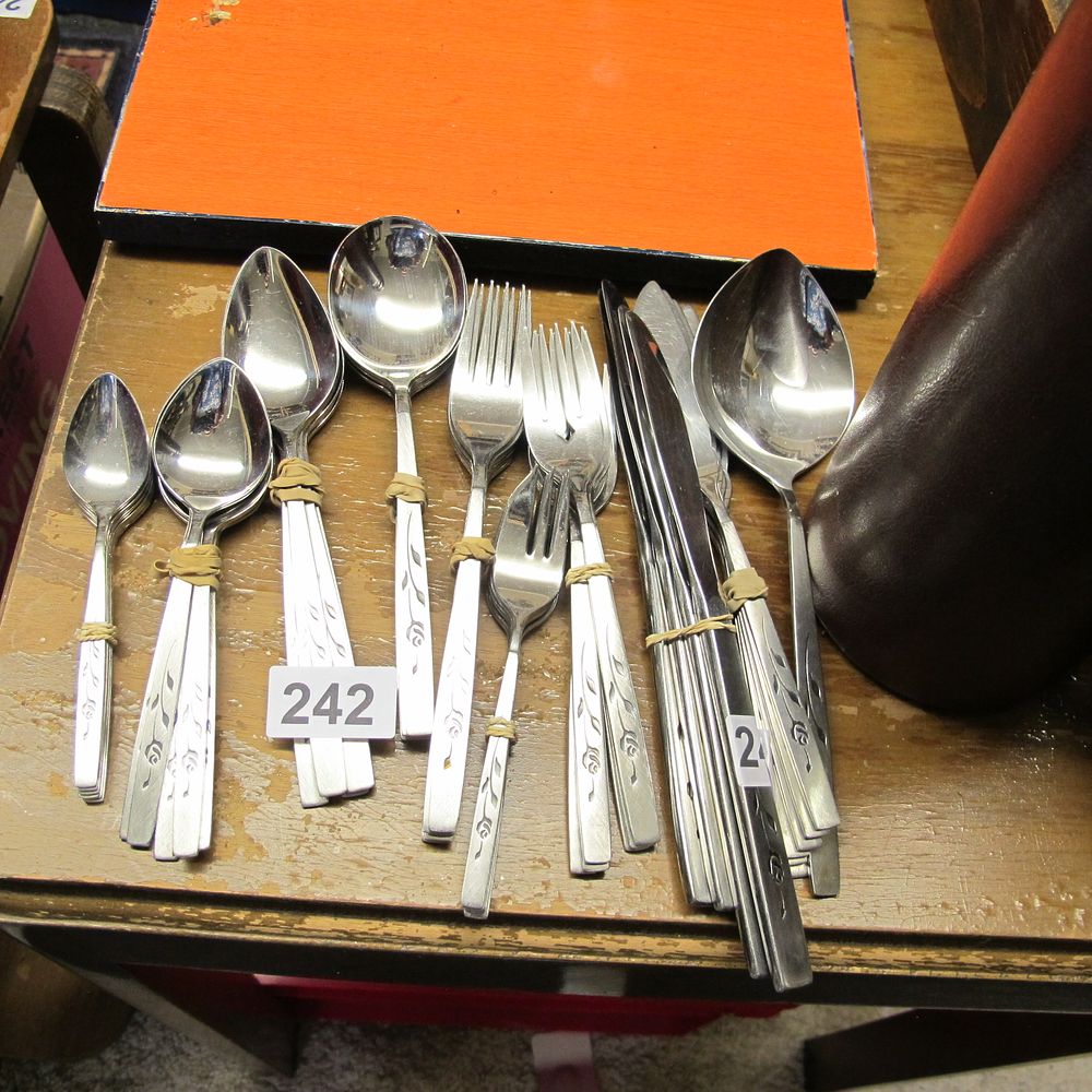 Lot 242: Stainless Steel Flatware Set with Etched Floral Pattern