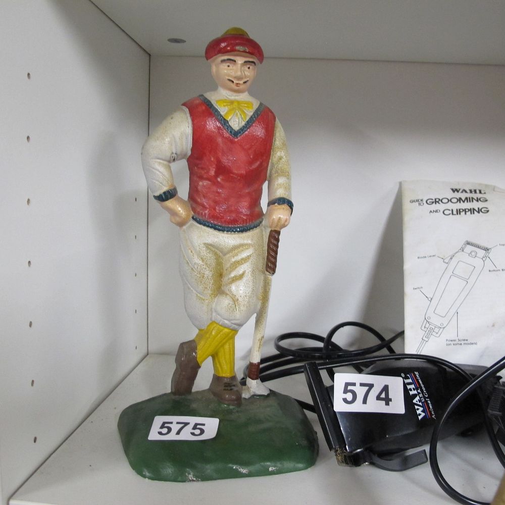 Lot 575: Painted Cast Iron Golfer Figure