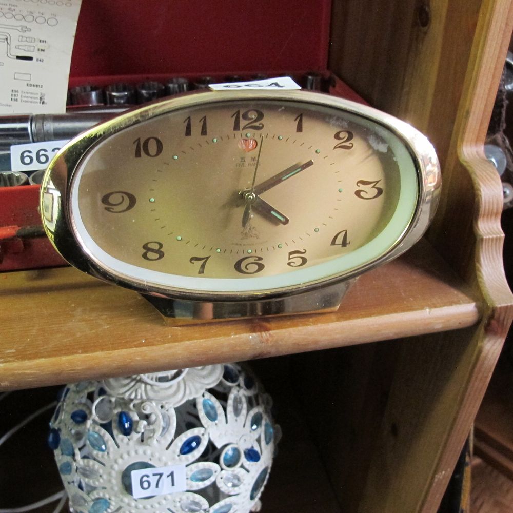 Lot 664: Vintage Five Rang Oval Gold-Tone Alarm Clock