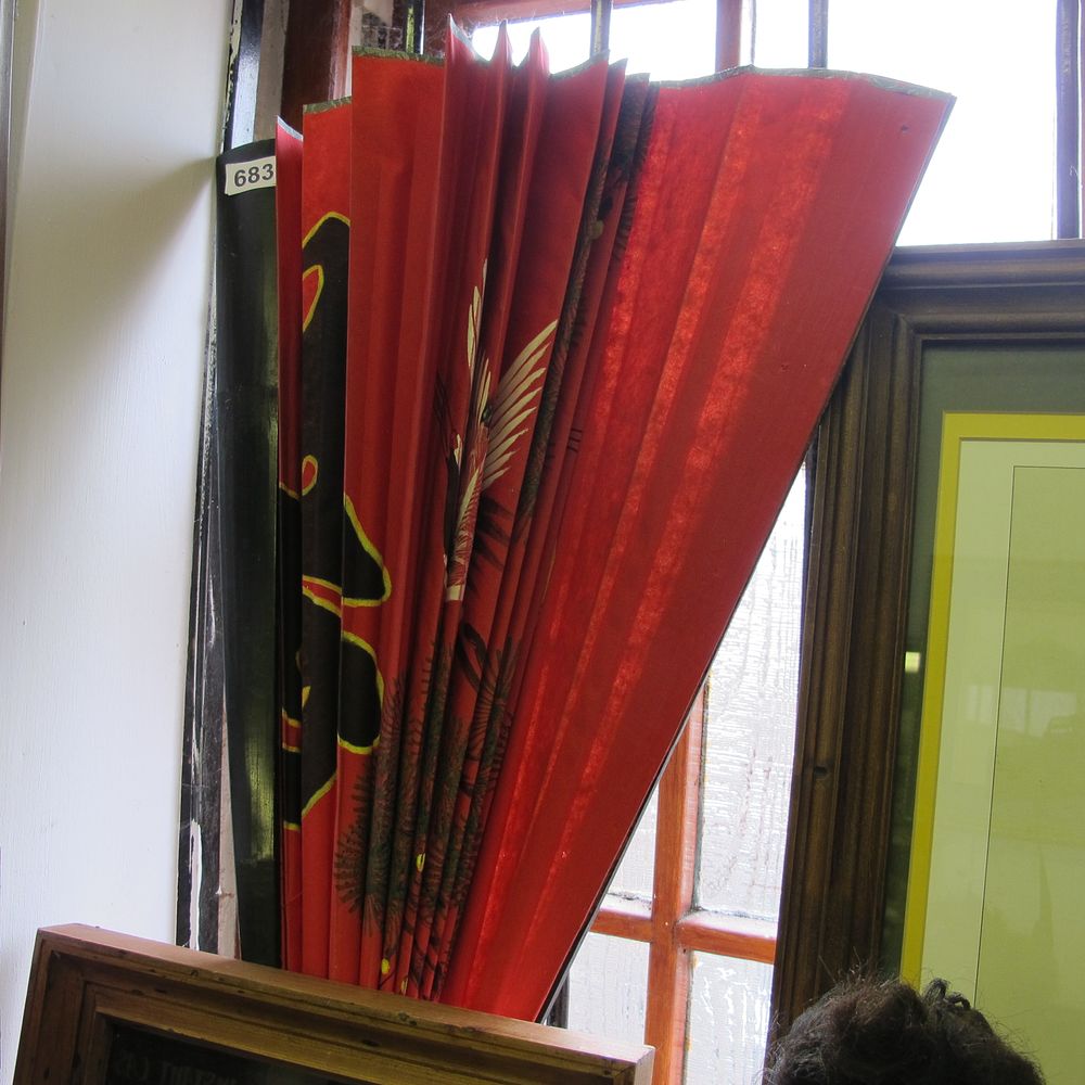 Lot 683: Pleated Red Fabric Screen with Bird and Foliage...
