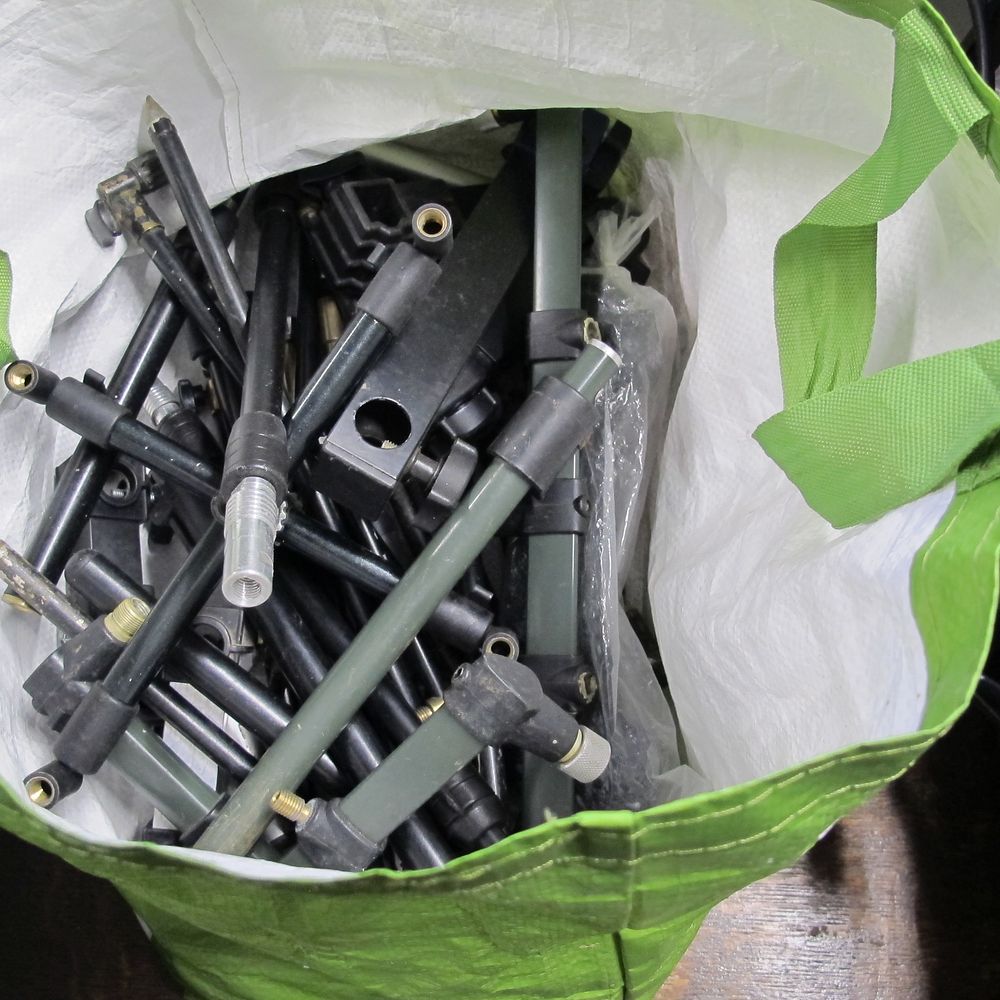 Lot 864: Disassembled Metal Rods and Components in Green Bag