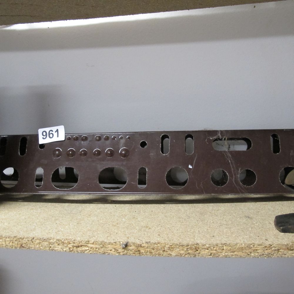Lot 961: Dark Brown Rectangular Metal Plate with Various Cutouts