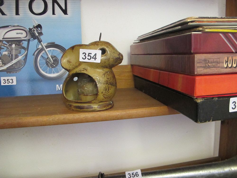 Lot 354: A Glazed Ceramic Stylized Rabbit Figurine, possibly a...
