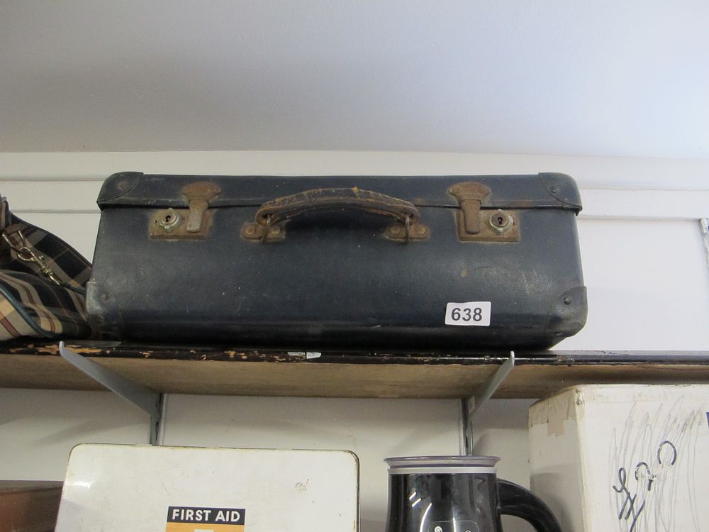 Lot 638: A Vintage Dark-Colored Suitcase