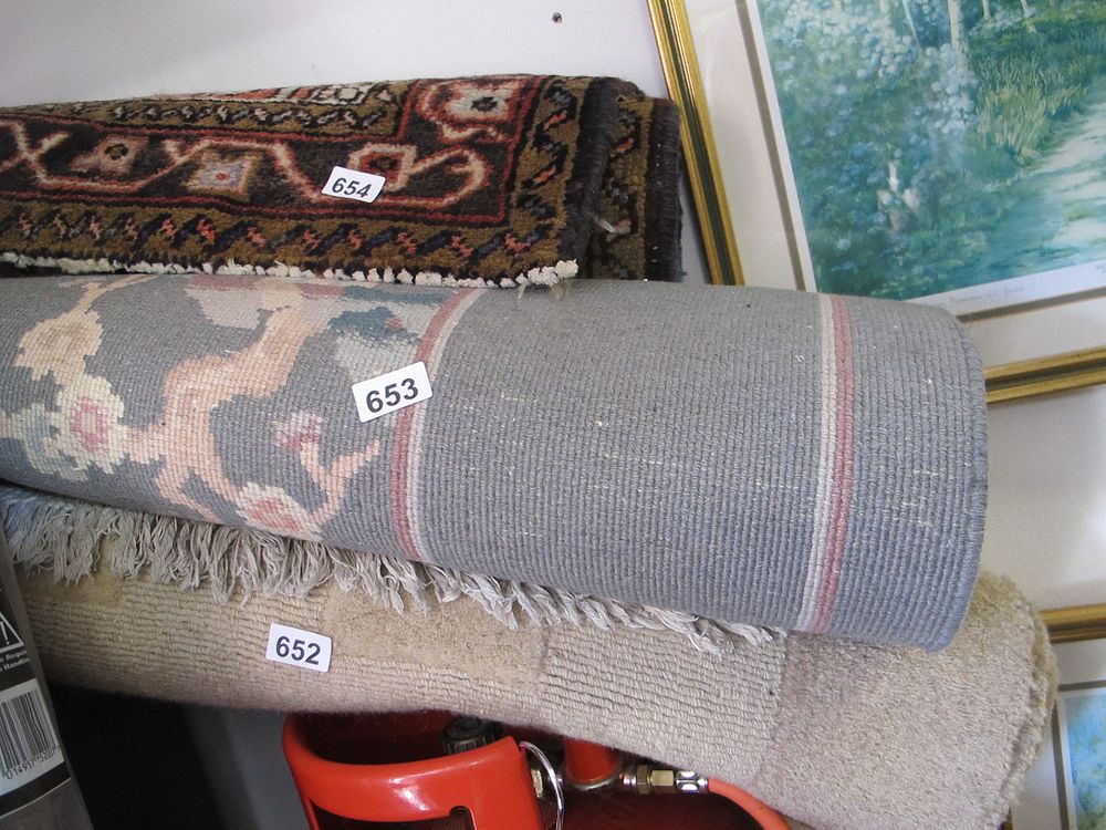 Lot 653: Rolled Woven Rug