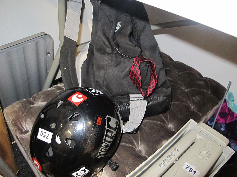 Lot 750: A Modern Sports Helmet and Backpack Assemblage
