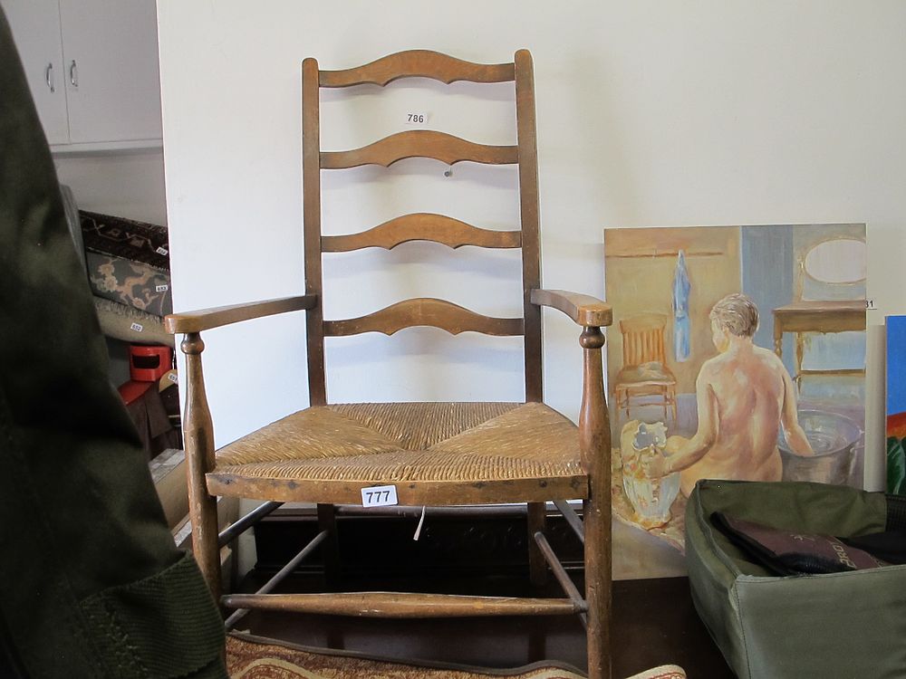 Lot 777: A Ladder-Back Armchair with Rush Seat