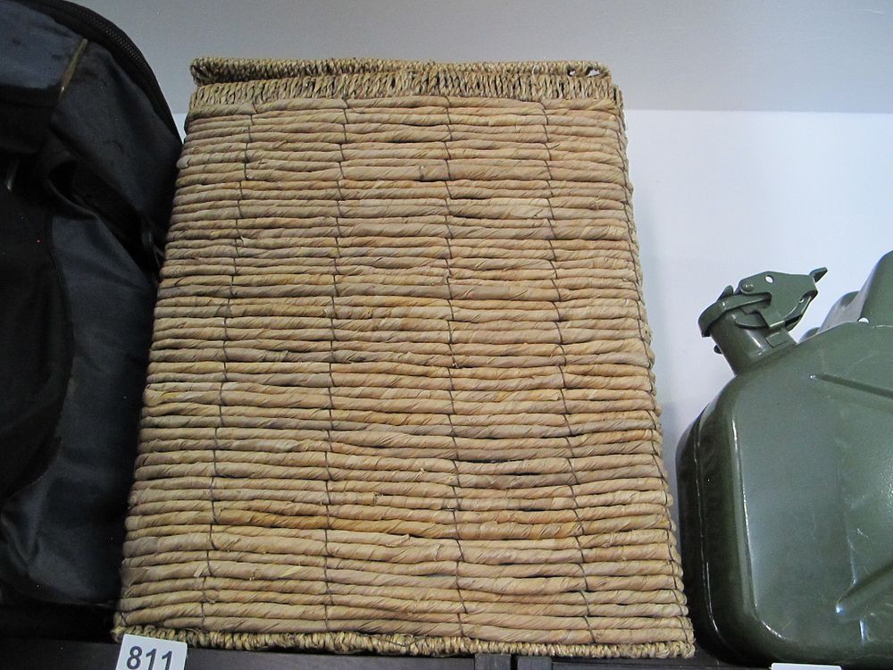 Lot 811: A Woven Natural Fiber Storage Basket