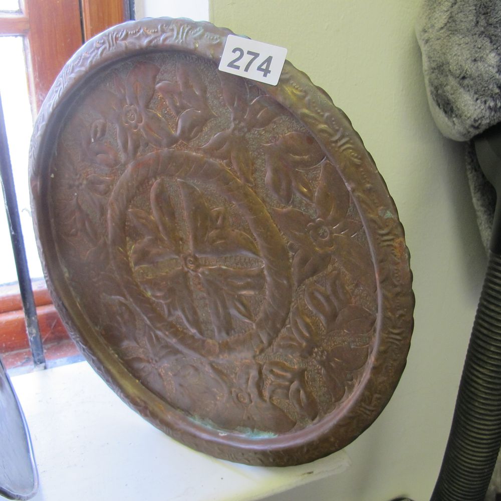 Lot 274: An Arts and Crafts Copper Repoussé Circular Charger