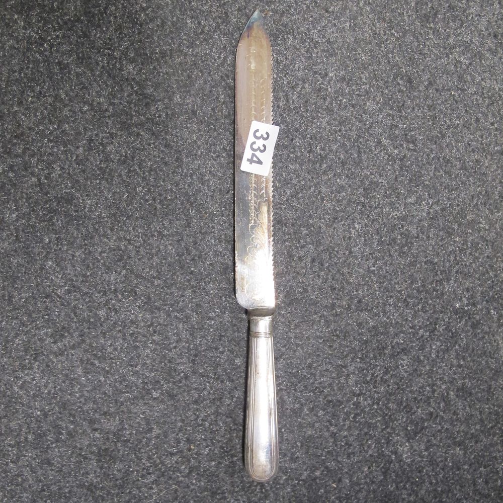 Lot 334: Antique Silver-Handled Serrated Bread Knife