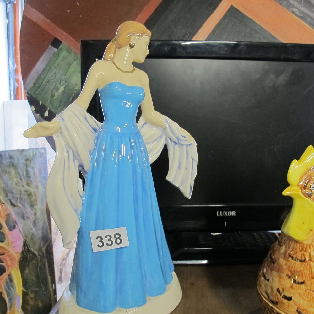 Lot 338: A Royal Doulton Glazed Porcelain Figurine of a...