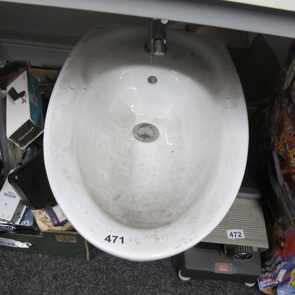 Lot 471: A Contemporary White Ceramic Bidet with Chrome Fittings