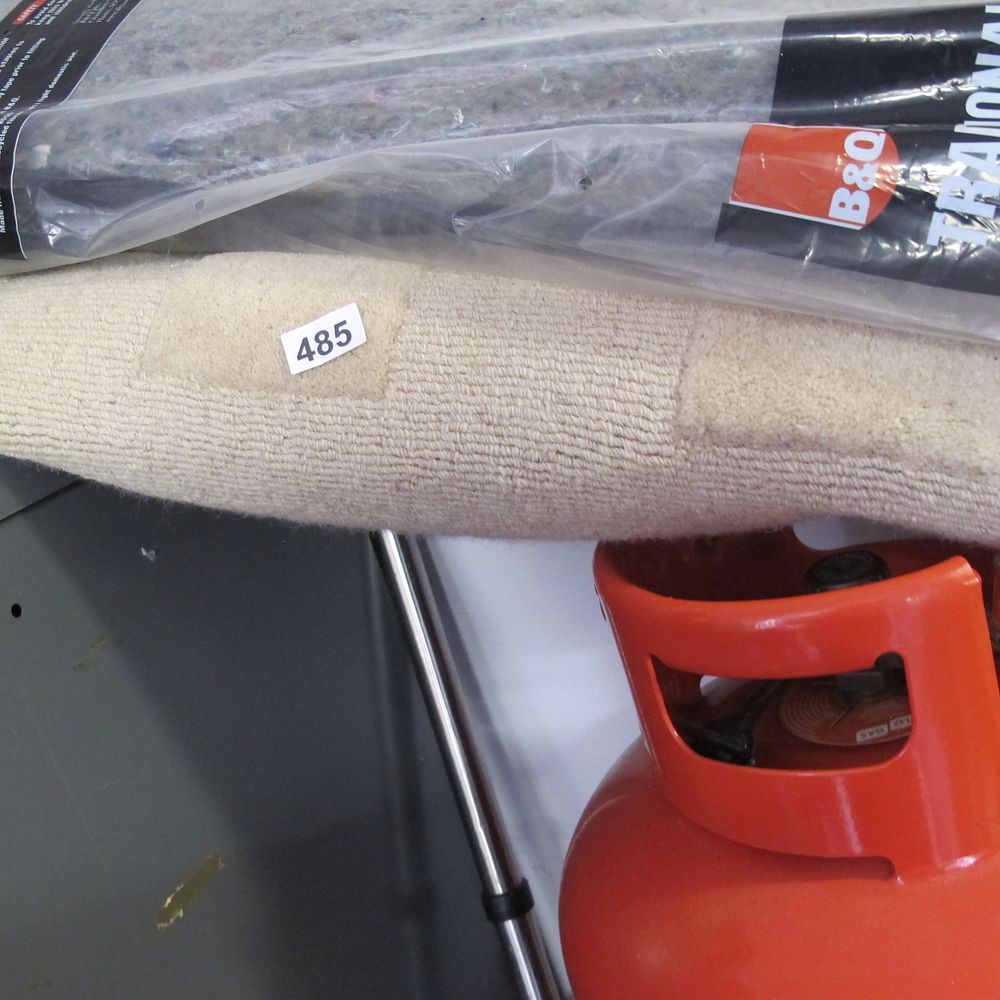 Lot 485: A Rolled Carpet