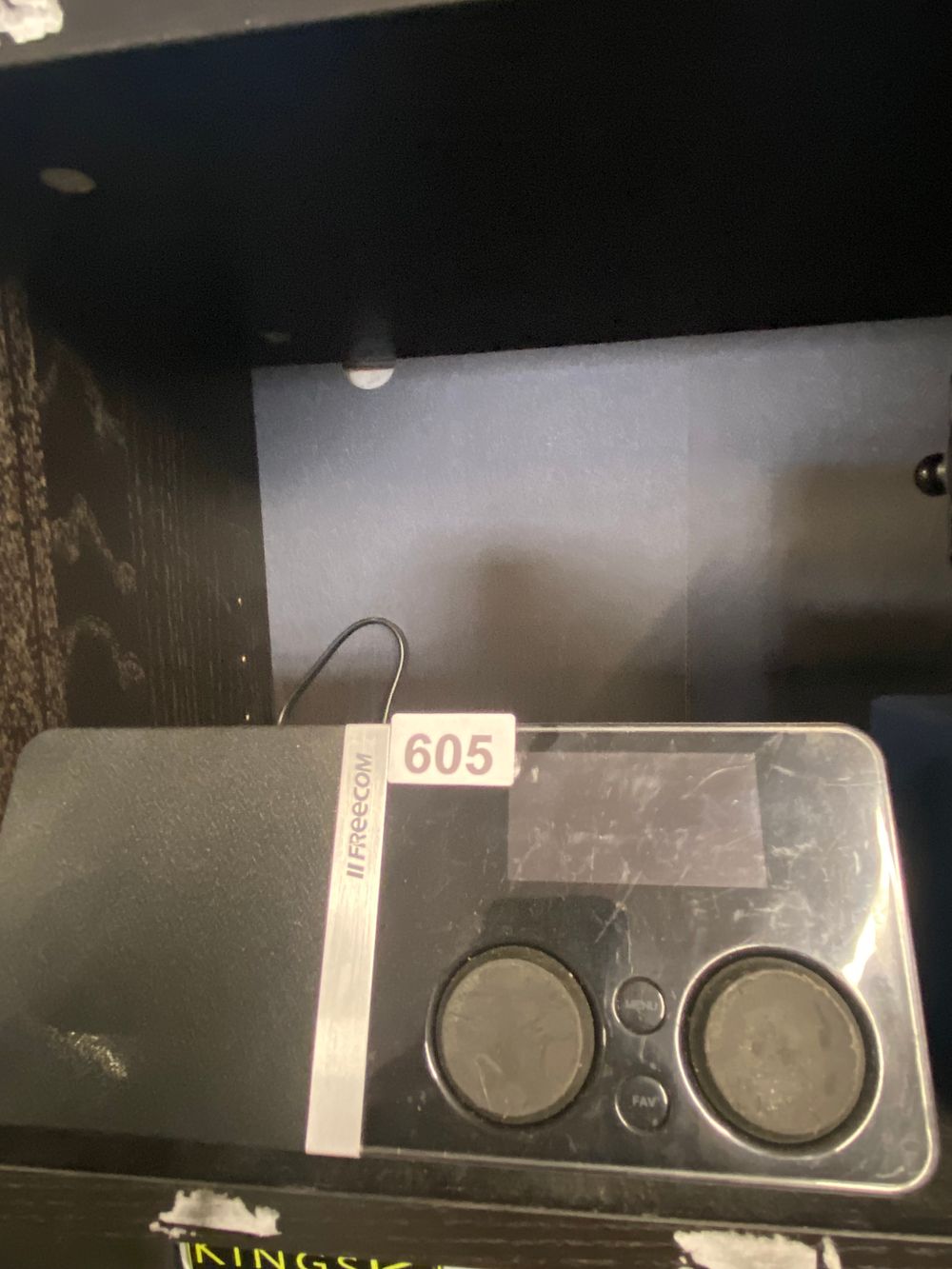 Lot 605: "II FREECOM" Portable Electronic Device, likely a Smart...