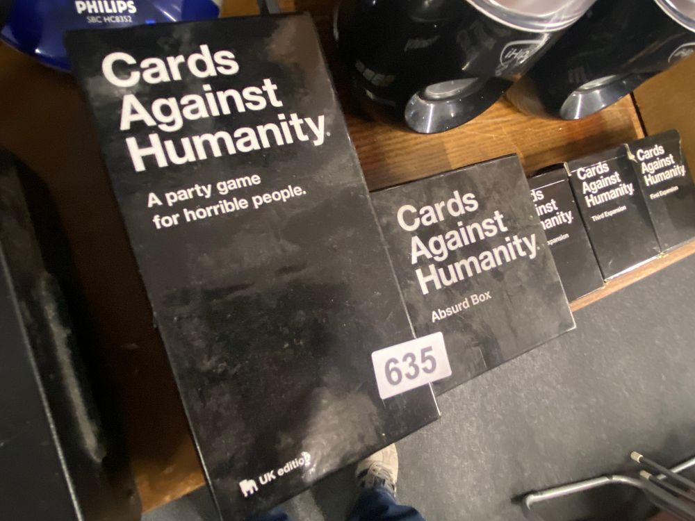 Lot 635: Cards Against Humanity UK Edition with Absurd Box,...