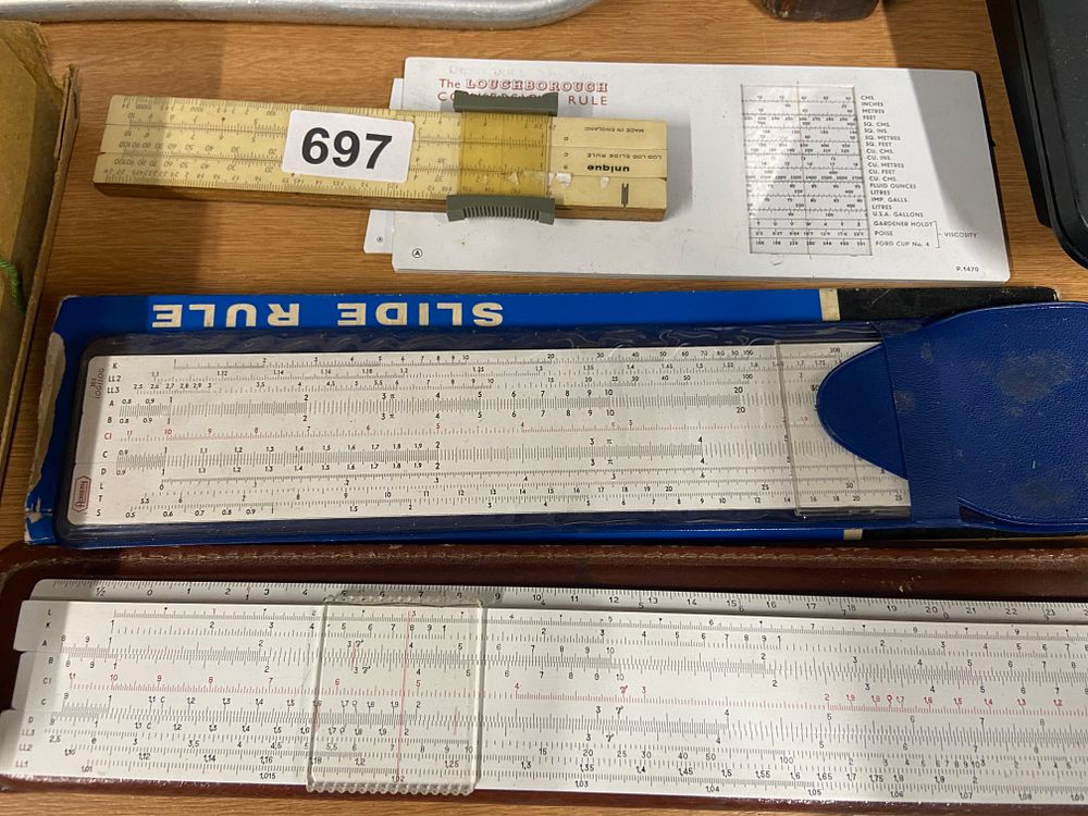 Lot 697: A Collection of Vintage Calculating Slide Rules, including...