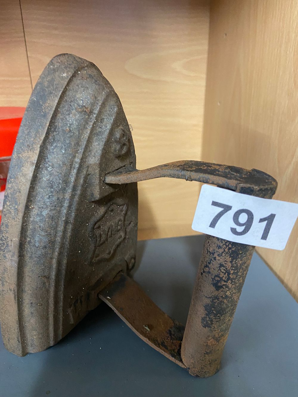 Lot 791: Antique Cast Iron Sad Iron with Partial Maker's...