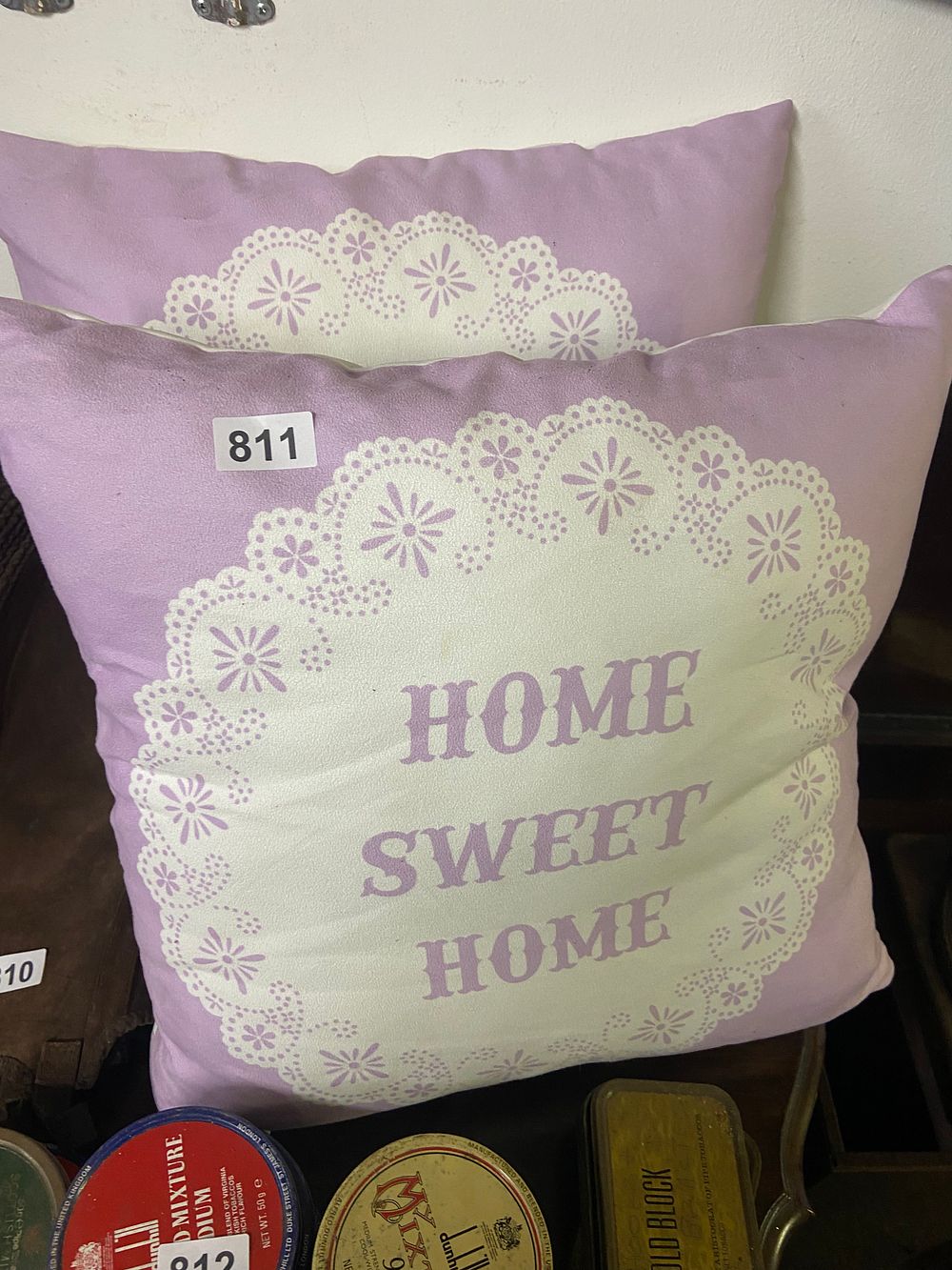 Lot 811: A Decorative Lavender-Purple 'Home Sweet Home' Cushion