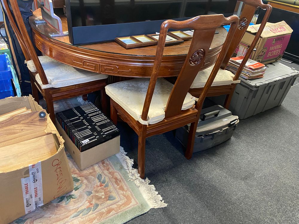 Lot 869: A Chinese Rosewood Dining Table and Three Chairs