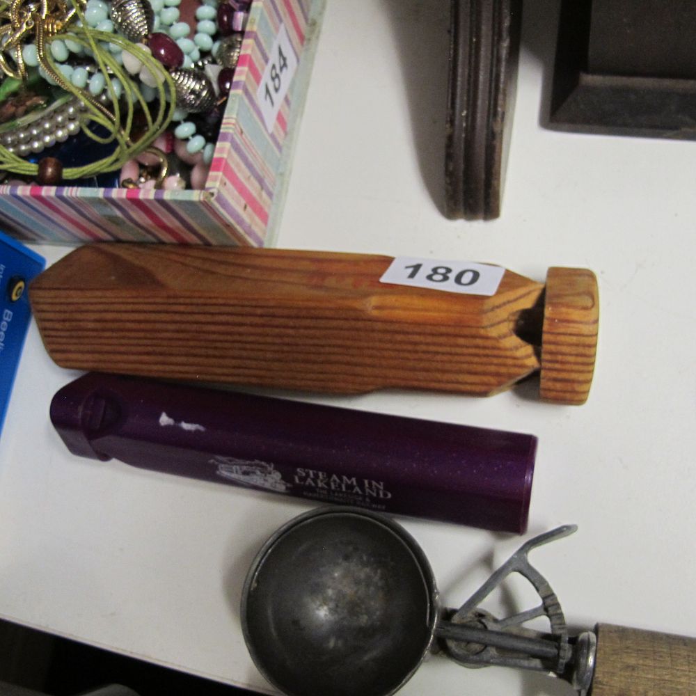 Lot 180: A Wooden Train Whistle and one other