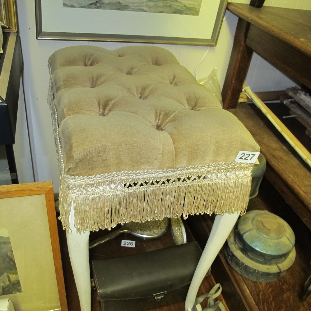 Lot 227: A Vintage Tufted Velvet Upholstered Ottoman with Fringe...
