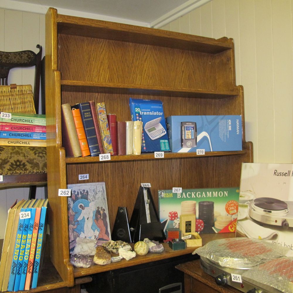 Lot 262:  on a Multi-Tiered Oak Bookshelf