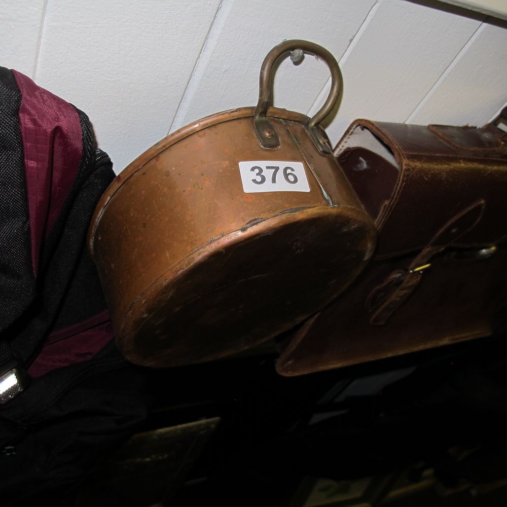 Lot 376: An Antique Patinated Copper Pot with Brass Swing...