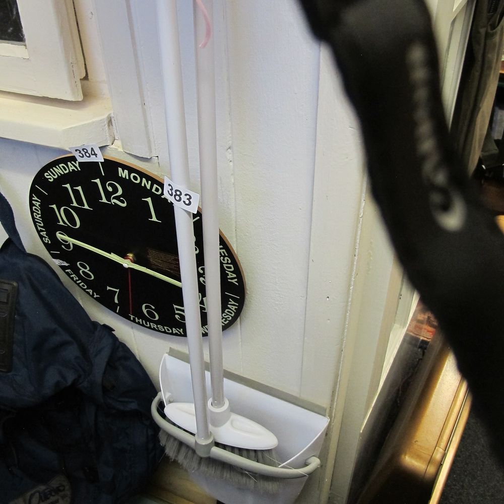 Lot 383: A Luminous Wooden Wall Clock, a Broom and...