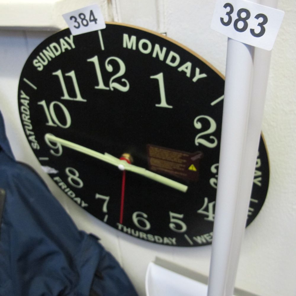 Lot 384: A 12 Inch Wooden Silent Non-Ticking Day of...