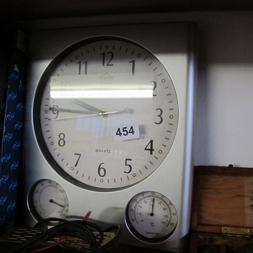 Lot 454: A Modern Silver-Tone Wall-Mounted Quartz Multi-Function Weather Station...