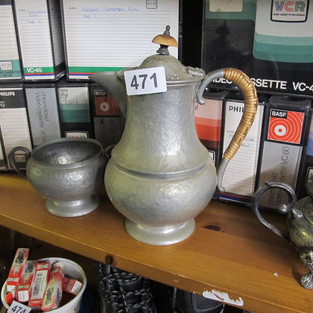 Lot 471: A Pair of Antique Hammered Pewter Pitcher and...