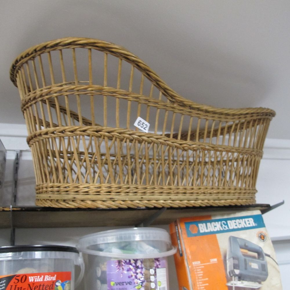 Lot 652: A Vintage Wicker and Rattan Bassinet Cradle