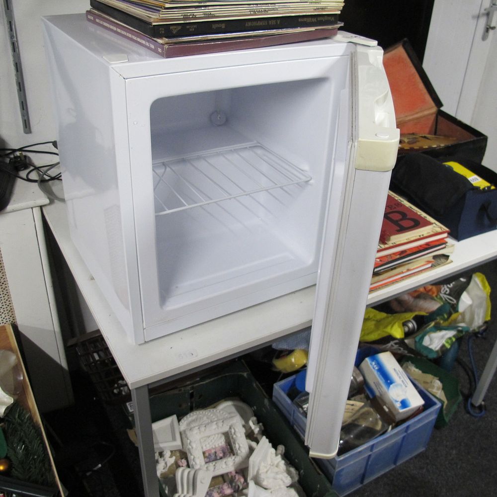 Lot 656: A Modern White Compact Mini-Refrigerator freezer