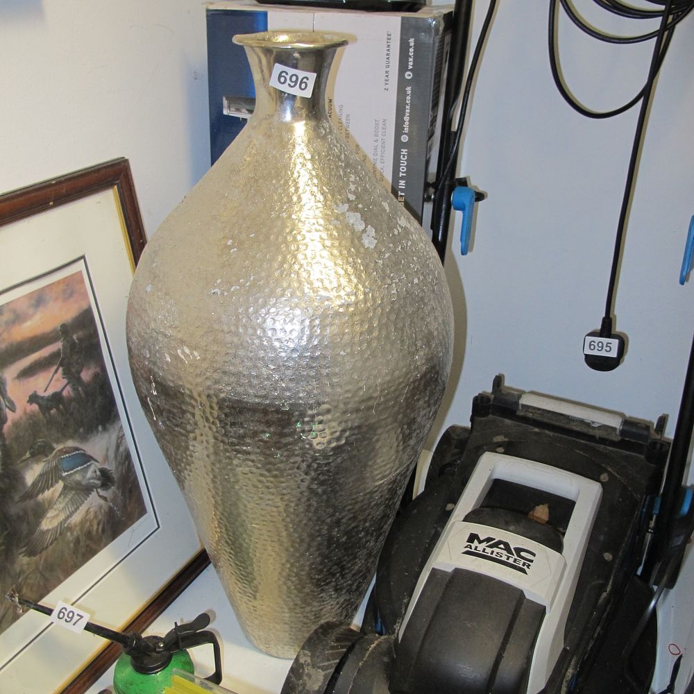 Lot 696: A Contemporary Hammered Silver-Toned Decorative Vase