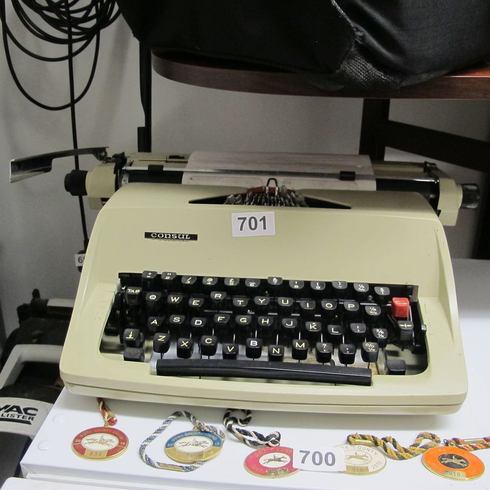 Lot 701: A Consul 2224 Portable Typewriter with a Group...