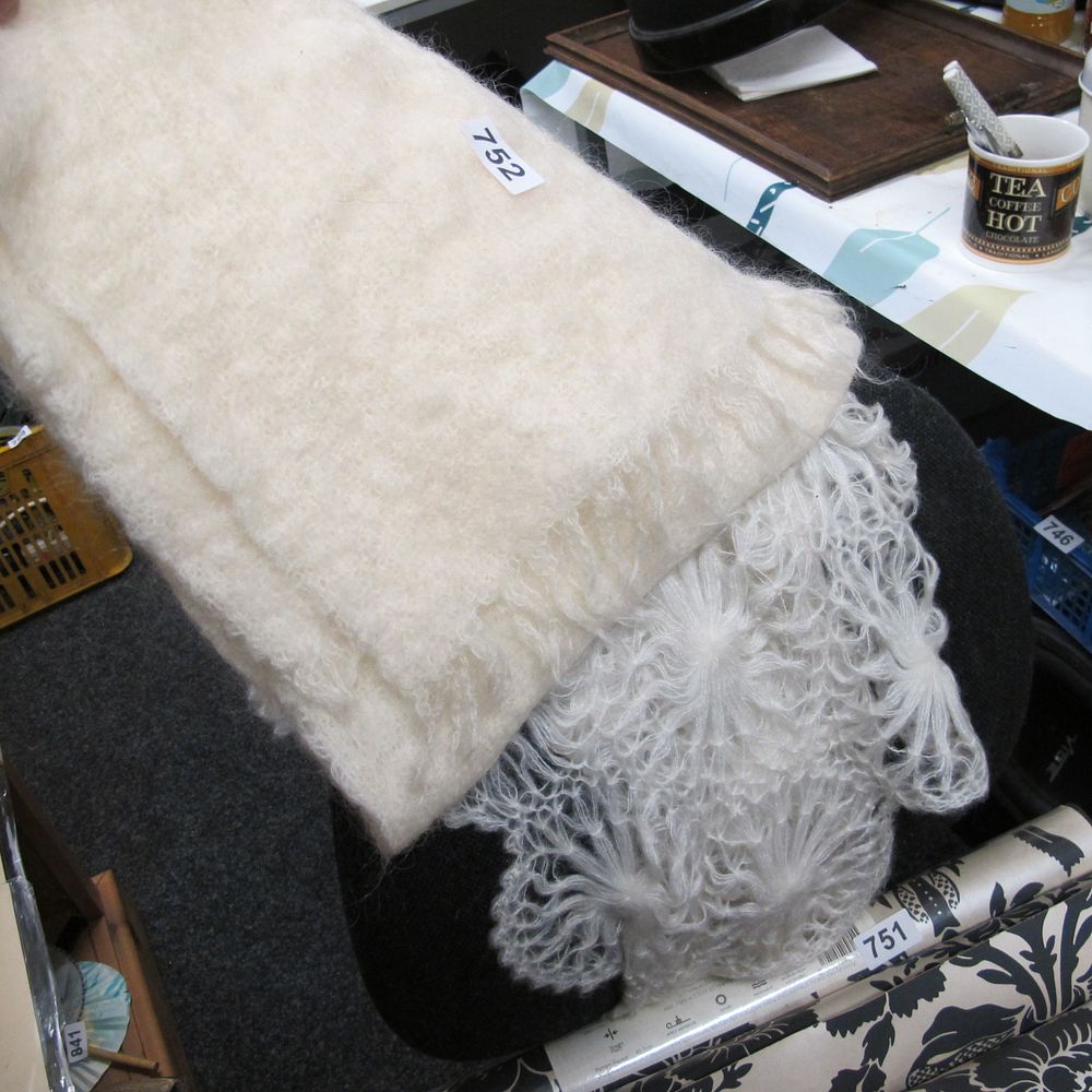 Lot 752: An Off-White Mohair and Wool Blend Scarf and...