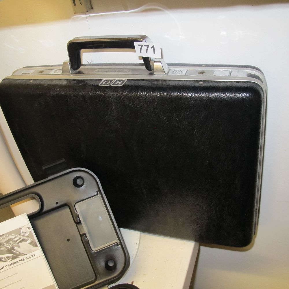 Lot 771: A Modern Black Hard-Sided Attache Case with 'OH'...