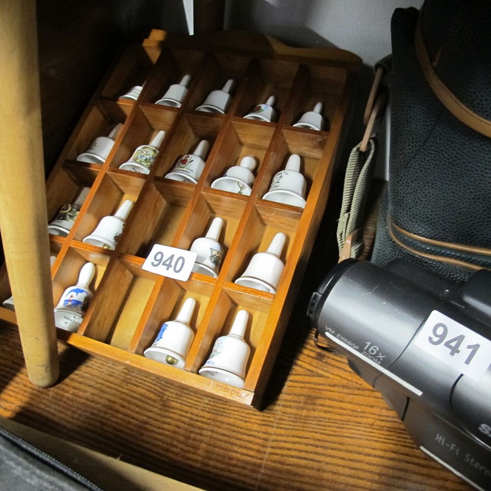 Lot 940: A Collection of Miniature Porcelain Bells in a...