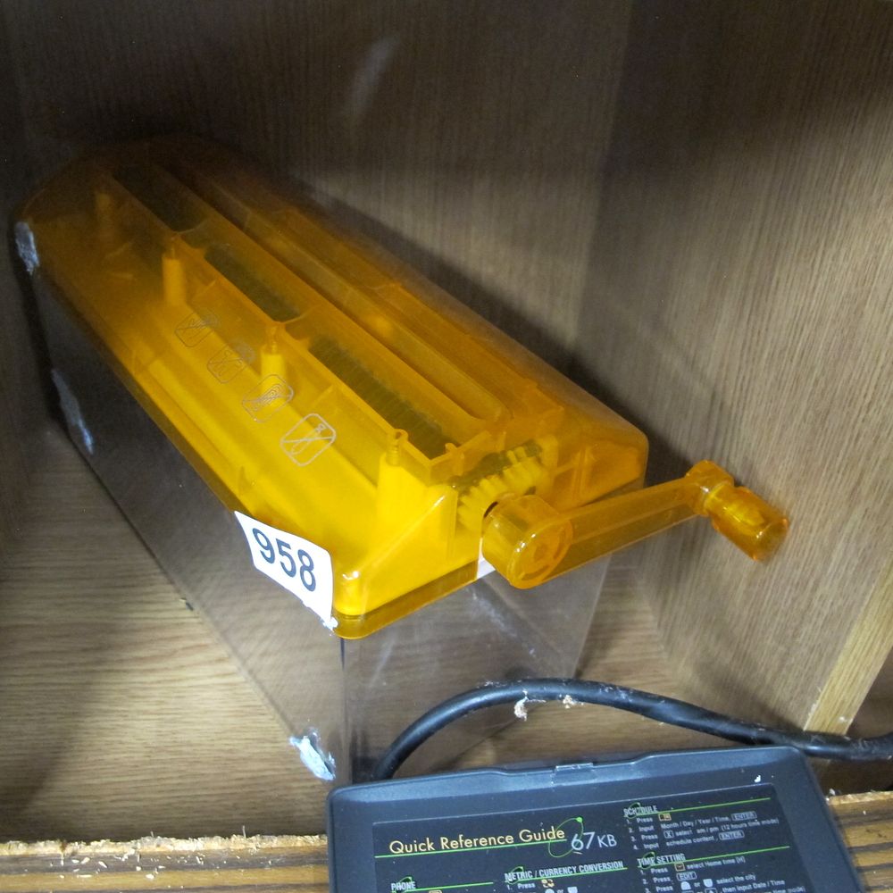 Lot 958: A Modern Transparent Yellow Plastic Manual Hand Crank...