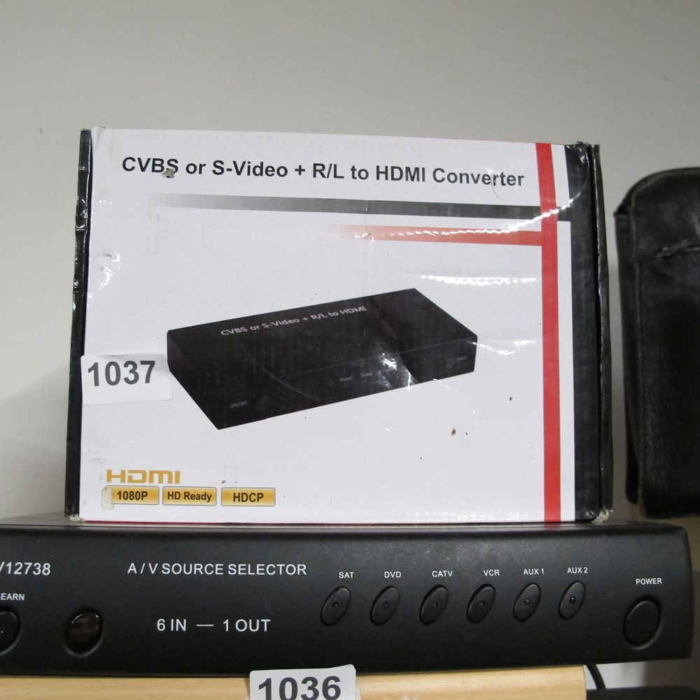 Lot 1037: A Pair of Contemporary A/V Electronic Devices: An...