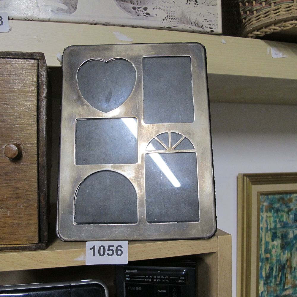 Lot 1056: A Silver-Toned Metal Multi-Opening Picture Frame