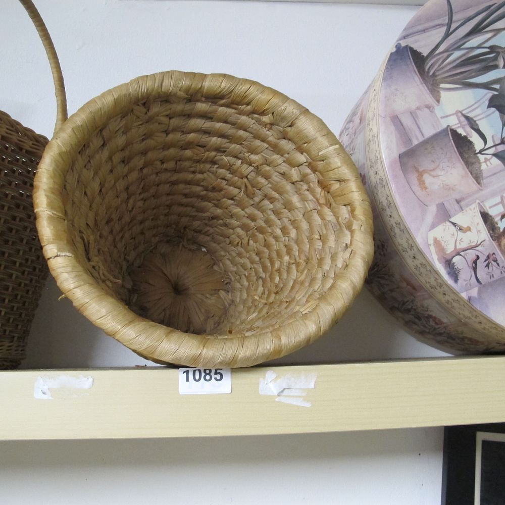 Lot 1085: A Woven Seagrass Basket with Handle