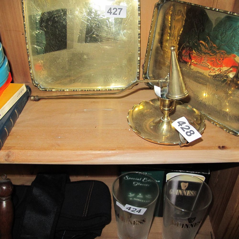 Lot 428: Candle holder and a snuffer in brass