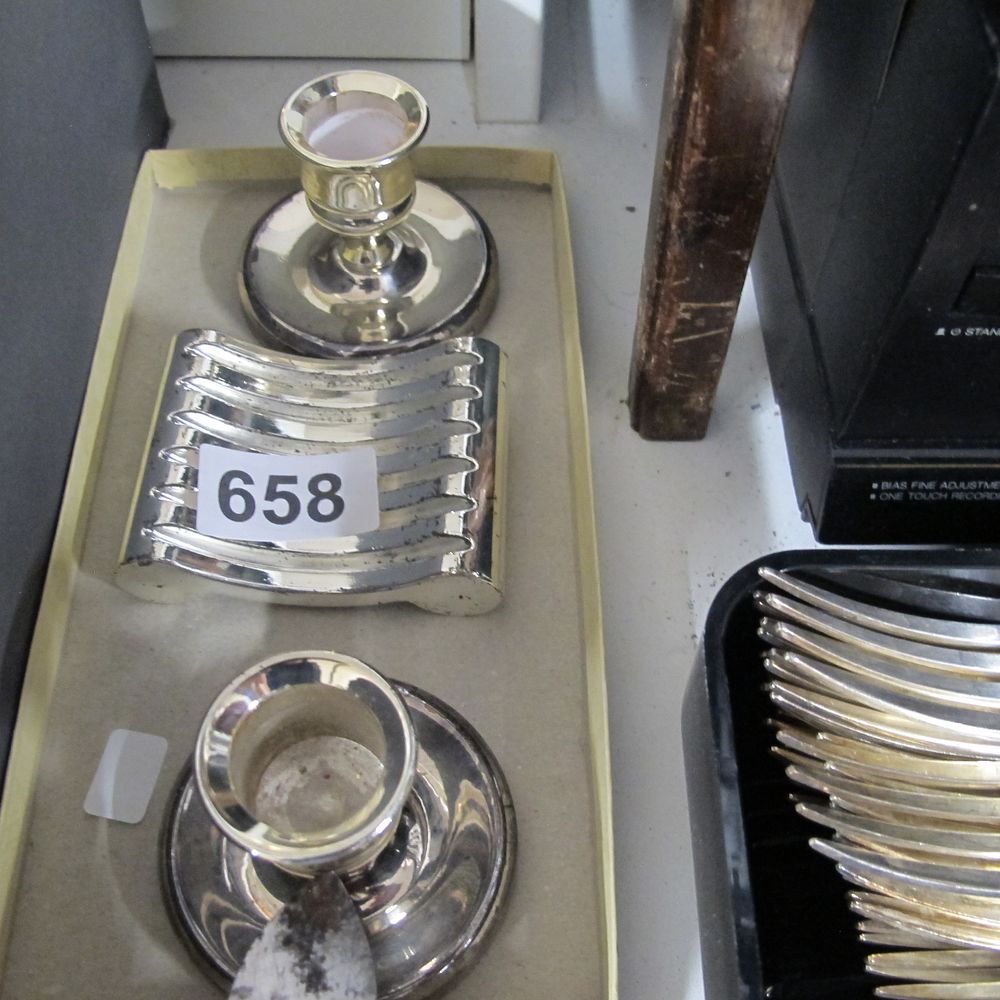 Lot 658: A collection of Silver-Plated candle stick holders and...