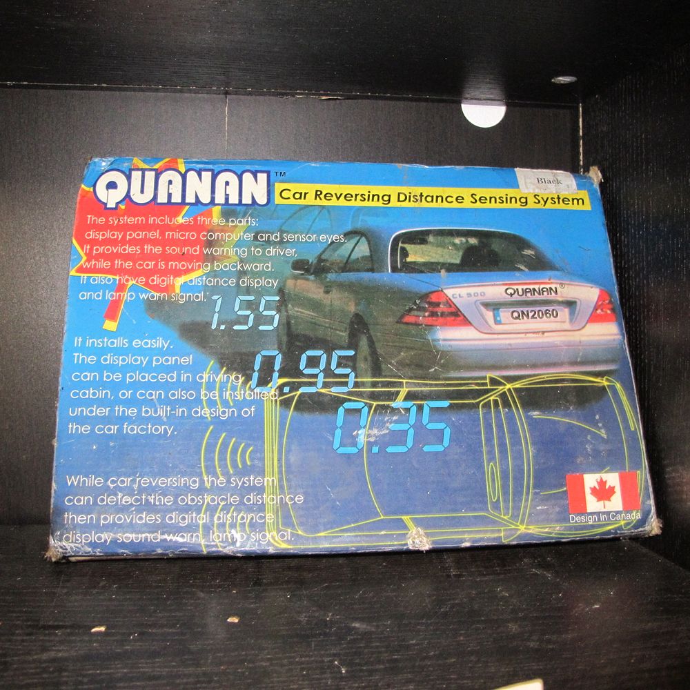 Lot 818: QUANAN Car Reversing Distance Sensing System, Cardboard Packaging,...