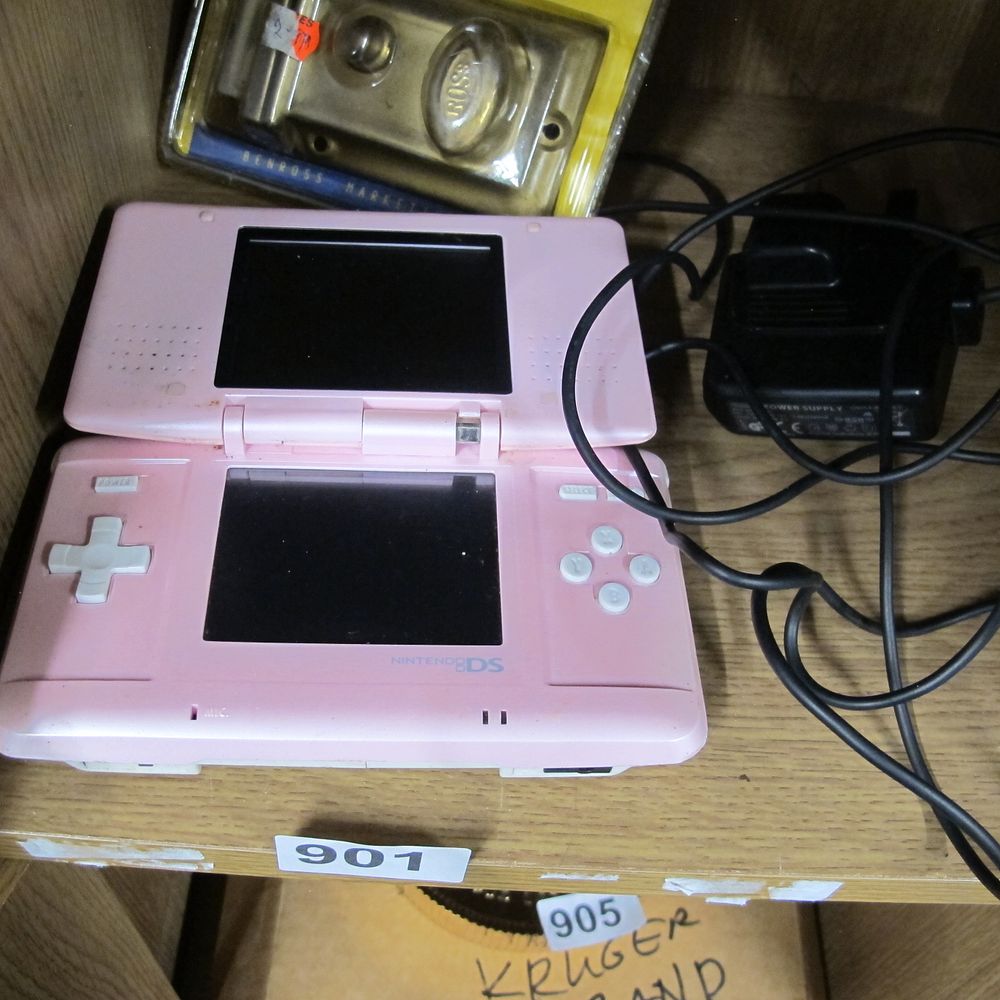 Lot 901: Nintendo DS NTR-001 Handheld Gaming Console in Candy...
