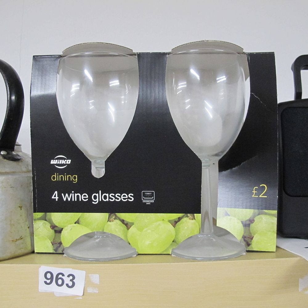 Lot 963: Wilko Dining Set of Four Clear Stemmed Wine...